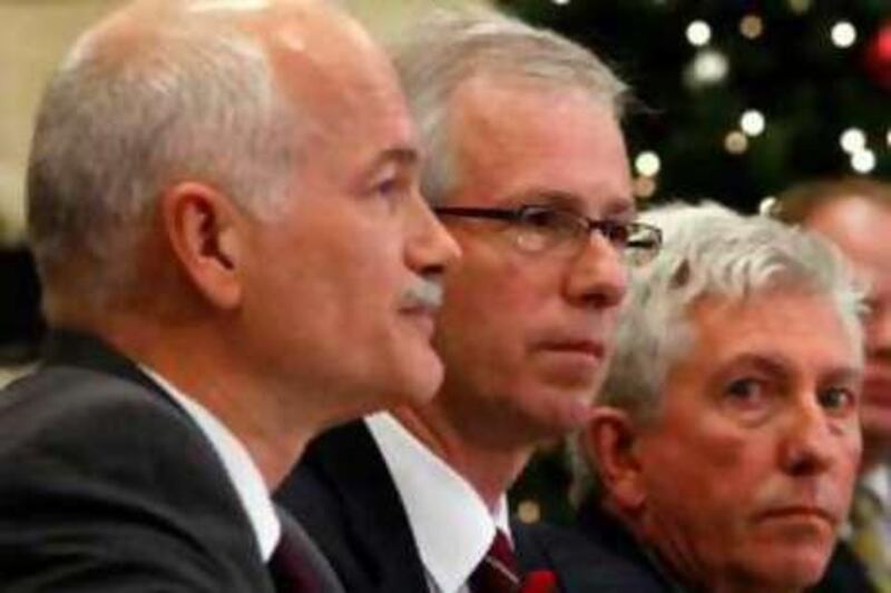 New Democratic Party leader Jack Layton (L), Liberal leader Stephane Dion (C) and Bloc Quebecois leader Gilles Duceppe take part in a news conference on Parliament Hill in Ottawa December 1, 2008. The leaders of Canada's three opposition parties said on Monday they have written to the Governor General asking her to call on Liberal leader Dion to form a new government.      REUTERS/Chris Wattie       (CANADA) *** Local Caption ***  OTW03_CANADA-POLITI_1201_11.JPG