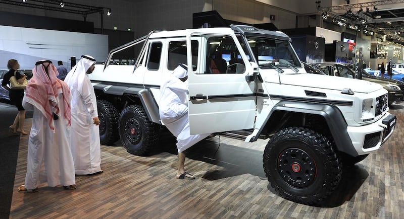 Visitors check out the new Mercedes-Benz G63 AMG 6x6 on display at the Dubai International Motor Show. Charles Crowell / The National