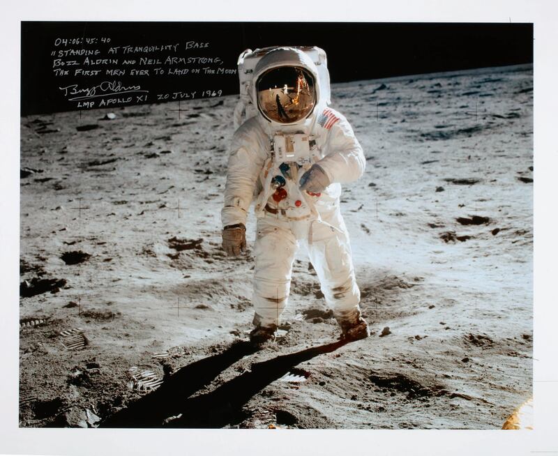 A colour photograph of Buzz Aldrin at Tranquility Base, signed and inscribed by Aldrin. Estimate: Dh11,019 to Dh18,365