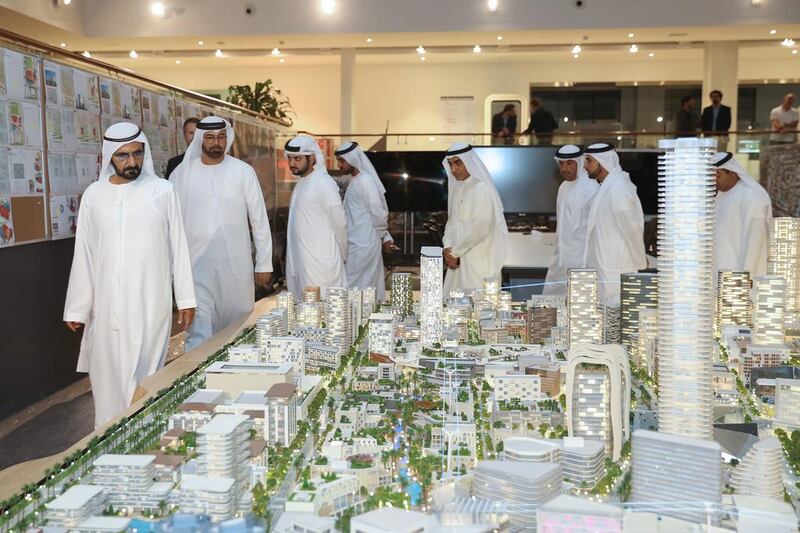 Sheikh Mohammed bin Rashid and some senior Dubai Holding officials view a scaled version of the Jumeirah Central project. WAM