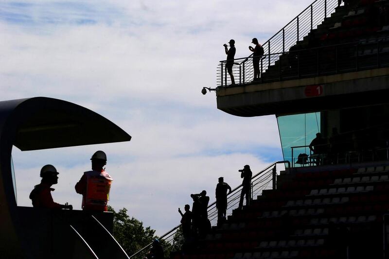People take pictures during the first free practicum of the Spanish Grand Prix at Barcelona-Catalunya racetrack in Montmelo, Spain. Juan Medina / Reuters / May 12, 2017