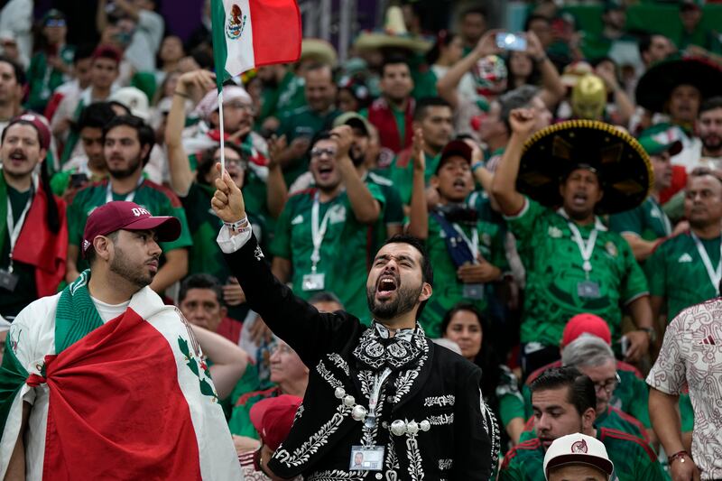 Mexico supporters make some noise in Lusail. AP