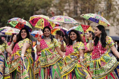 Dancers with their umbrellas during a Diwali celebration in Trafalgar Square, London. PA 