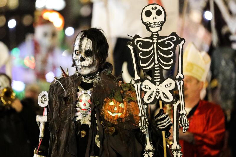 People in skeleton costumes participate in the parade. Reuters