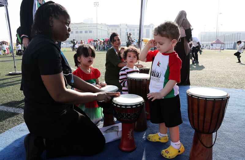 Pupils and parents celebrating National Day at Gems Wellington Academy in Dubai