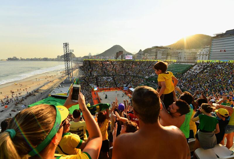 RIO DE JANEIRO, BRAZIL - AUGUST 06:  Fans enjoy the atmosphere on Day 1 of the Rio 2016 Olympic Games at the Beach Volleyball Arena on August 6, 2016 in Rio de Janeiro, Brazil.  (Photo by Quinn Rooney/Getty Images)