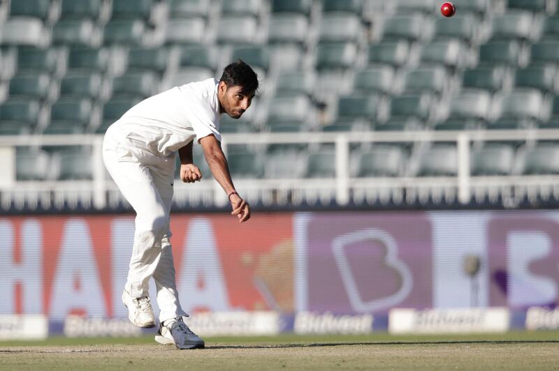 Indian bowler Bhuvneshwar Kumar (C) bowls on South African batsman Aiden Markram (not in picture) during the first day of the third test match between South Africa and India at Wanderers cricket ground on January 24, 2018 in Johannesburg.   / AFP PHOTO / GIANLUIGI GUERCIA