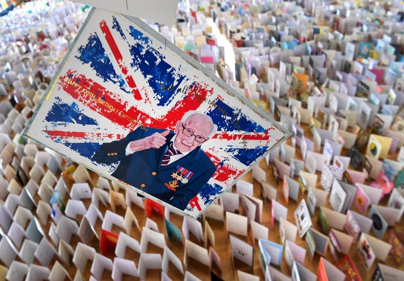BEDFORD, ENGLAND - APRIL 29:  A general view of thousands of birthday cards sent to Captain Tom Moore for his 100th birthday on April 30th, are pictured displayed in the Hall of Bedford School, closed-down due to the COVID-19 pandemic, in Bedford, on April 29, 2020. - 99-year-old Moore raised just money for Britain's National Health Service (NHS) following the novel coronavirus outbreak, by walking 100 laps of his garden. (Photo by Shaun Botterill/Getty Images)