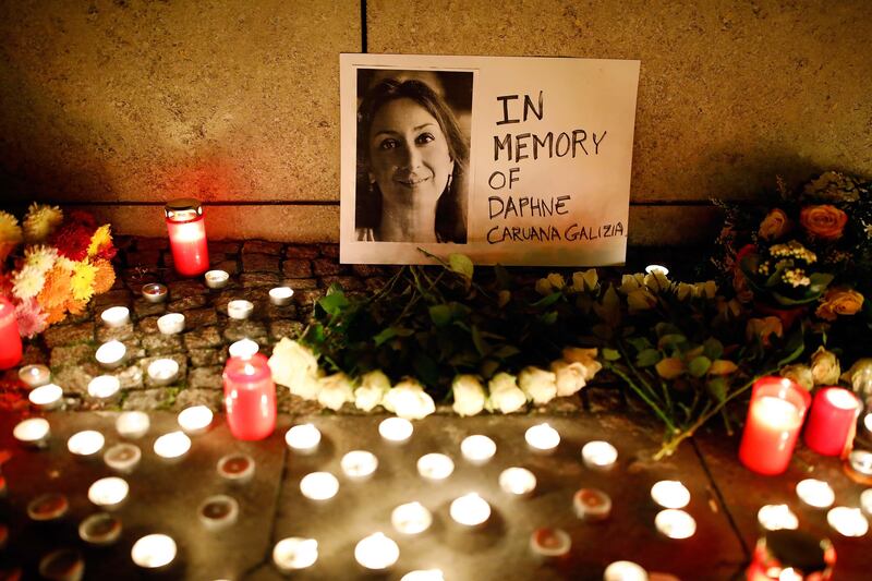 Candles burn to commemorate the killed investigative journalist Daphne Caruana Galizia in Berlin, Germany, October 20, 2017. REUTERS/Axel Schmidt