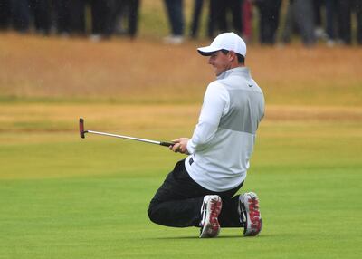 epa06900180 Rory McIlroy of Northern Ireland drops to his knees after putting the 18th in the second round of the British Open Golf Championship at Carnoustie, Britain, 20 July 2018.  EPA/GERRY PENNY