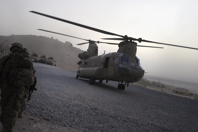 In this photograph taken on July 29, 2011 a US military Chinook helicopter lands at  Forward Operating Base in Arghandab district southern Afghanistan. Thirty-one US special forces and seven Afghans died when the Taliban shot down their helicopter, officials said on August 6, 2011, the deadliest incident yet for foreign troops in a decade-long war. All were killed during an anti-Taliban operation late Friday when a rocket fired by the insurgents struck their Chinook helicopter in Wardak province, southwest of the capital Kabul, as they prepared to leave after a firefight. AFP PHOTO / ROMEO GACAD
 *** Local Caption ***  563901-01-08.jpg