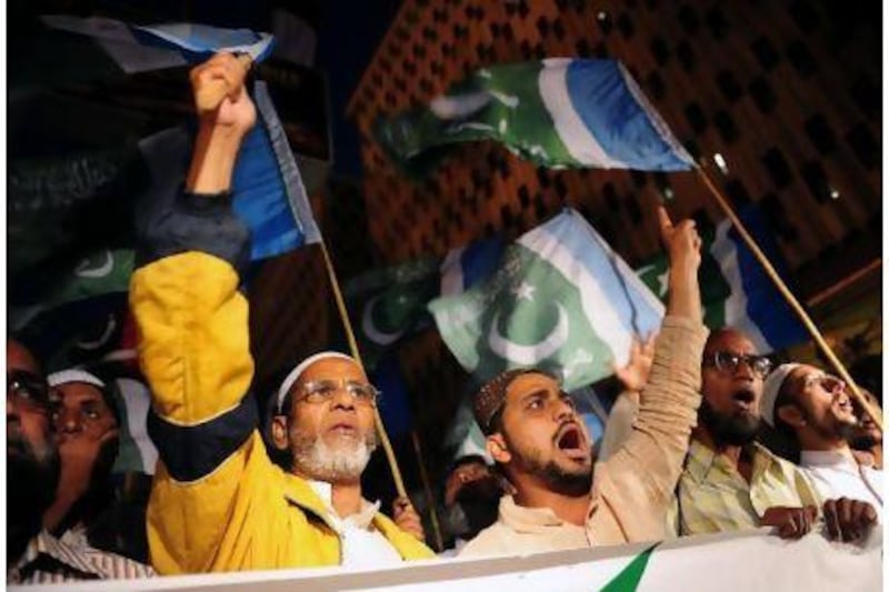 Activists from the Pakistani fundamentalist Islamic party Jamaat-i-Islami shout slogans against the release of CIA contractor Raymond Davis during a protest in Karachi yesterday.