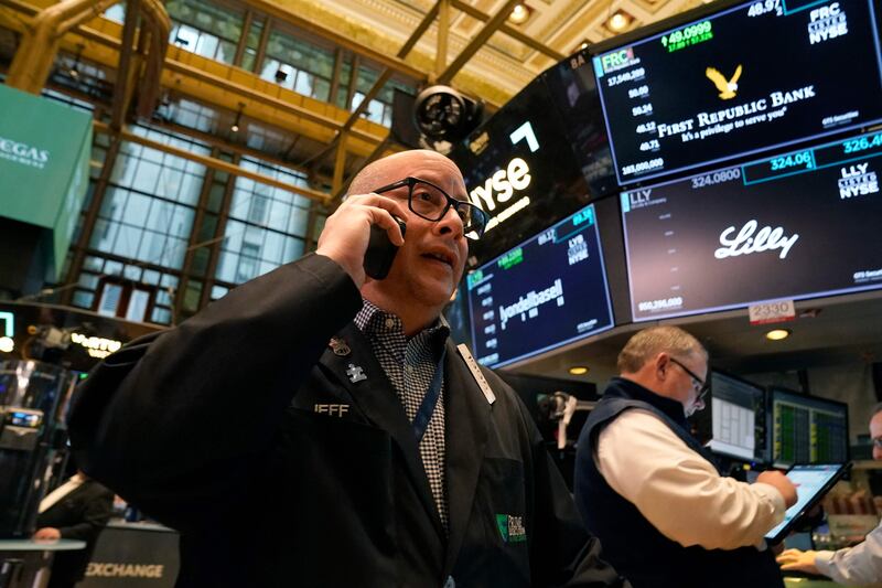 Traders on the floor of the New York Stock Exchange. US stock markets closed higher while Treasury yields rose sharply on Tuesday. AFP