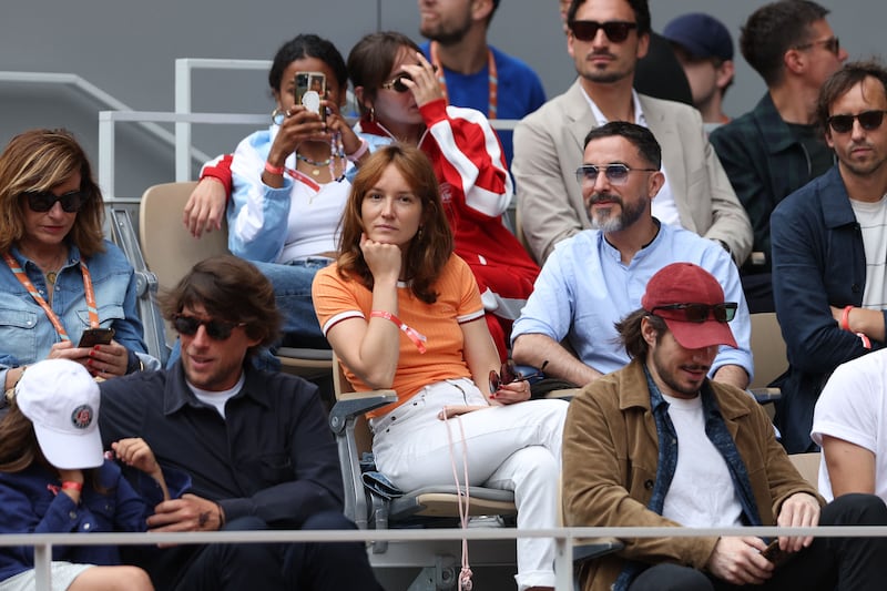 French actress Anais Dumoustier in the stands at Court Philippe-Chatrier. AFP