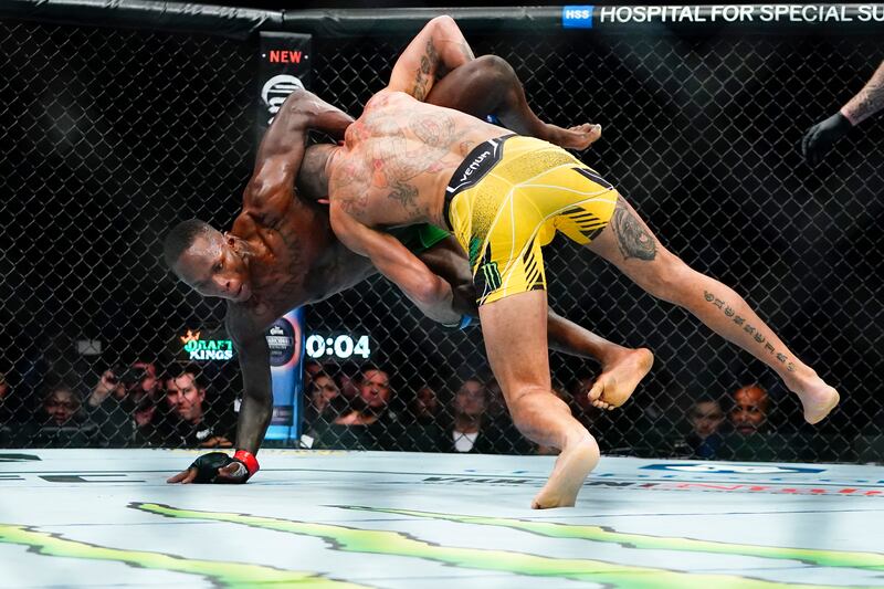 Alex Pereira takes down Israel Adesanya during the second round. AP