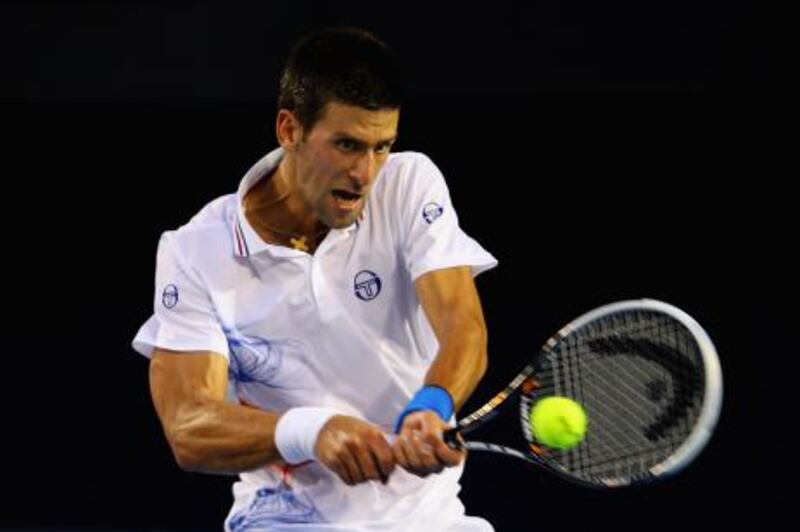 MELBOURNE, AUSTRALIA - JANUARY 25:  Novak Djokovic of Serbia plays a backhand in his quarter final match against David Ferrer of Spain during day ten of the 2012 Australian Open at Melbourne Park on January 25, 2012 in Melbourne, Australia.  (Photo by Mark Kolbe/Getty Images) *** Local Caption ***  137685555.jpg