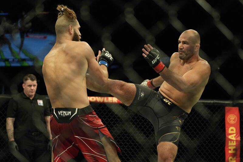 Glover Teixeira attempts to kick Jiri Prochazka during their light heavyweight title fight at UFC 275. AFP