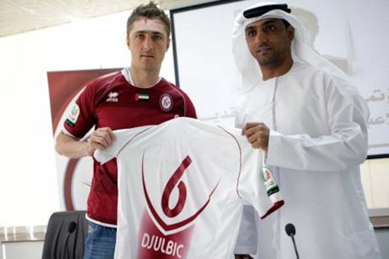 Al Wahda's January transfer window signing Dino Djulbic with manager Abdullah Salem.