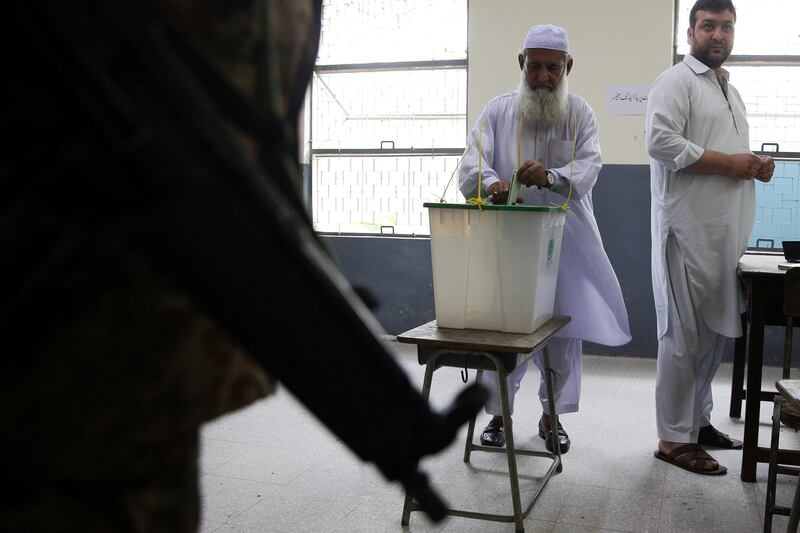 Voters cast their votes at a polling station in Islamabad. Reuters