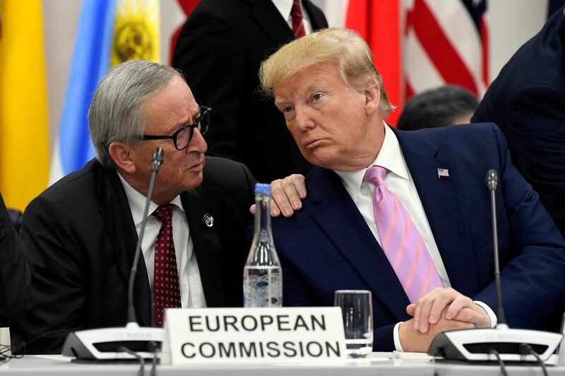 Mr Trump speaks to European Commission president Jean-Claude Juncker during a session. AP Photo