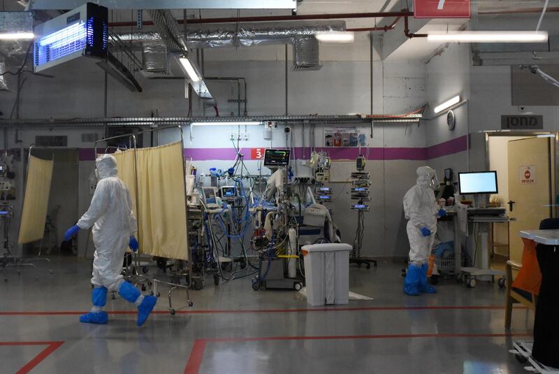 Medical personnel work inside the coronavirus intensive care unit at Sheba Medical Center, close to Tel Aviv. Rosie Scammell / The National