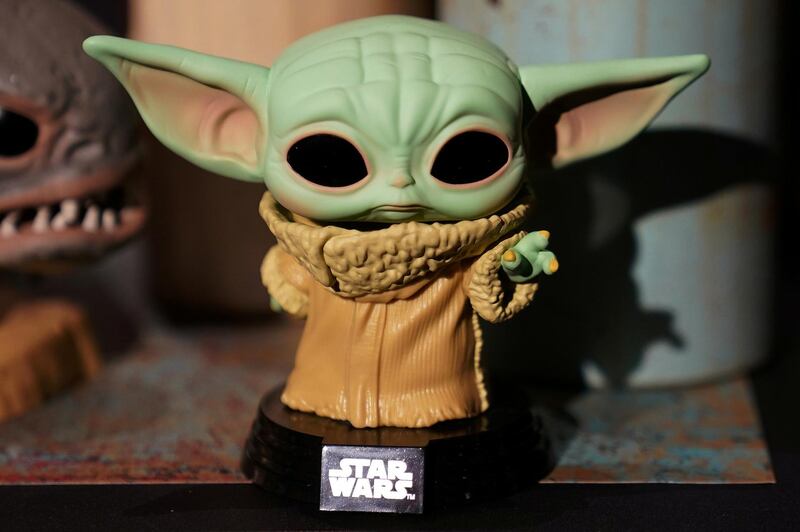FILE PHOTO: A Baby Yoda toy is pictured during a "Star Wars" advance product showcase in the Manhattan borough of New York City, New York, U.S., February 20, 2020. REUTERS/Carlo Allegri/File Photo