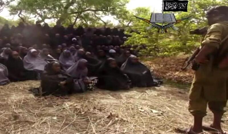 A screengrab of a video released by Nigerian Islamist extremist group Boko Haram on May 12, 2014 showing some of the kidnapped schoolgirls in Nigeria who are still missing. One mother has confirmed that her daughter was seen in the video. AFP Photo