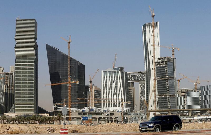 FILE PHOTO: A vehicle drives past the King Abdullah Financial District in Riyadh, Saudi Arabia, October 18, 2017. REUTERS/Faisal Al Nasser/File Photo