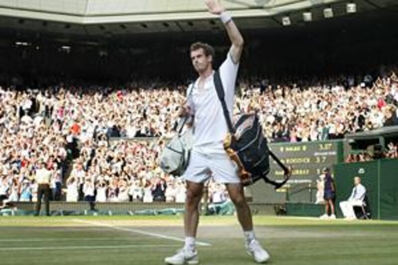Beaten semi-finalist Andy Murray salutes the Centre Court crowd after losing to Andy Roddick.