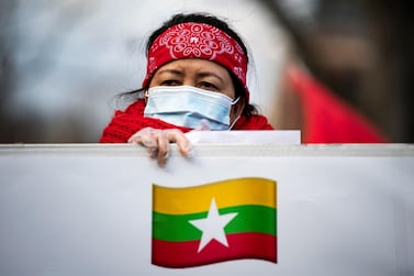 People protest against the military coup and to demand the release of elected leader Aung San Suu Kyi, outside of the Embassy of Myanmar in Washington, U.S., February 9, 2021. REUTERS