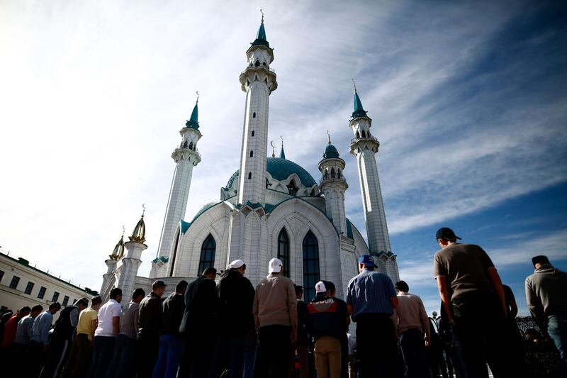 Muslims pray in front of the Qul Sharif Mosque in Kazan, Russia. Benjamin Cremel / AFP
