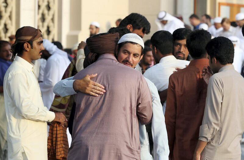 DUBAI, UNITED ARAB EMIRATES, August 21 – 2018 :- People greeting each other after the Eid Al Adha prayers at the Jumeirah Mosque in Dubai. ( Pawan Singh / The National )  For News. Story by Nawal