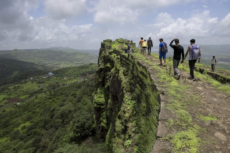 Visitors walk along the ruins of the Lohagad hill fort, near Lonavla in the western Indian state of Maharashtra. First built upon by Indian dynasties stretching back to the Satavahana Empire around the first century BC, the fortified Lohagad, meaning Iron Fort, is based on a flat-top hill in India's Western Ghats mountain range and was still in use by successive empires up until the 1800s. The fort is a popular destination for hikers during the monsoon season when heavy rains brings out fresh foliage in the region. Alex Ogle / AFP