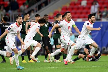 DOHA, QATAR - JANUARY 28: Akhtam Nazarov of Tajikistan and teammates celebrate victory following the penalty shootout in the AFC Asian Cup Round of 16 match between Tajikistan and United Arab Emirates at Ahmad Bin Ali Stadium on January 28, 2024 in Doha, Qatar. (Photo by Adam Nurkiewicz / Getty Images)