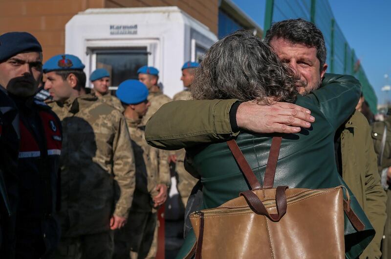 Family members and friends celebrate after a court acquitted nine leading Turkish civil society activists of terrorism-related charges including Osman Kavala, an entrepreneur known for philanthropy who has been jailed for more than two years, in Silivri, outside Istanbul. AP Photo