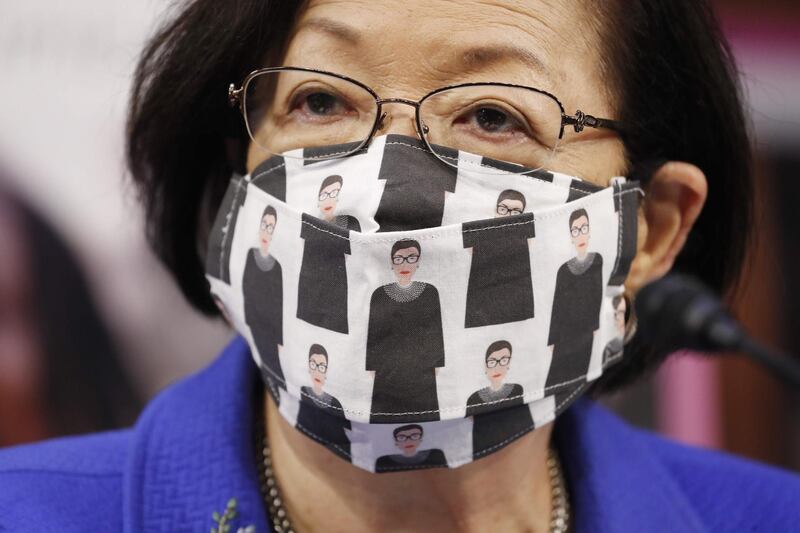 US Democratic Senator from Hawaii, Mazie Hirono, wears a mask showing former Supreme Court Justice Ruth Bader Ginnsburg as Supreme Court nominee Judge Amy Coney Barrett participates in her confirmation hearing before the Senate Judiciary Committee on Capitol Hill in Washington, DC. AFP