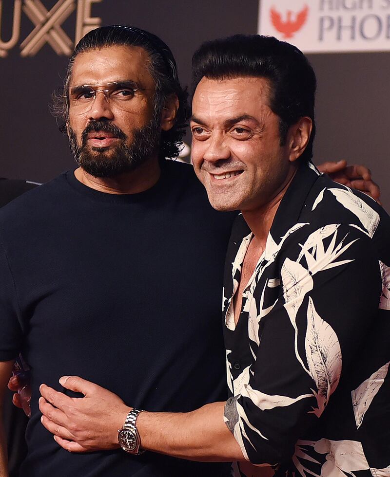 Bollywood actors Suniel Shetty, left, and Bobby Deol, right, attend the premiere of Hindi film 'Bharat' in Mumbai on June 4, 2019.  AFP