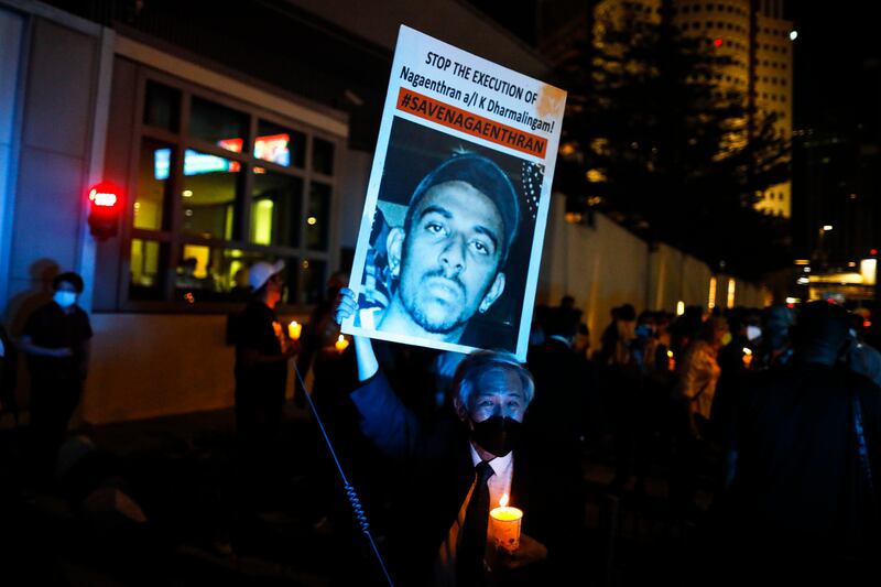 About 300 people held a candlelight vigil at a Singapore park on Monday to protest against the hanging. EPA 