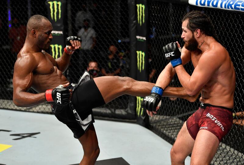 A handout image released by the Ultimate Fighting Championship (UFC) on July 12, 2020, shows Nigeria's Kamaru Usman (L) kicking US' Jorge Masvidal in their welterweight championship fight during the UFC 251 event at UFC Fight Island in Abu Dhabi's Yas Island.  -  === RESTRICTED TO EDITORIAL USE - MANDATORY CREDIT "AFP PHOTO / HO / ZUFFA LLC" - NO MARKETING NO ADVERTISING CAMPAIGNS - DISTRIBUTED AS A SERVICE TO CLIENTS ===
 / AFP / ZUFFA LLC / Jeff BOTTARI /  === RESTRICTED TO EDITORIAL USE - MANDATORY CREDIT "AFP PHOTO / HO / ZUFFA LLC" - NO MARKETING NO ADVERTISING CAMPAIGNS - DISTRIBUTED AS A SERVICE TO CLIENTS ===
