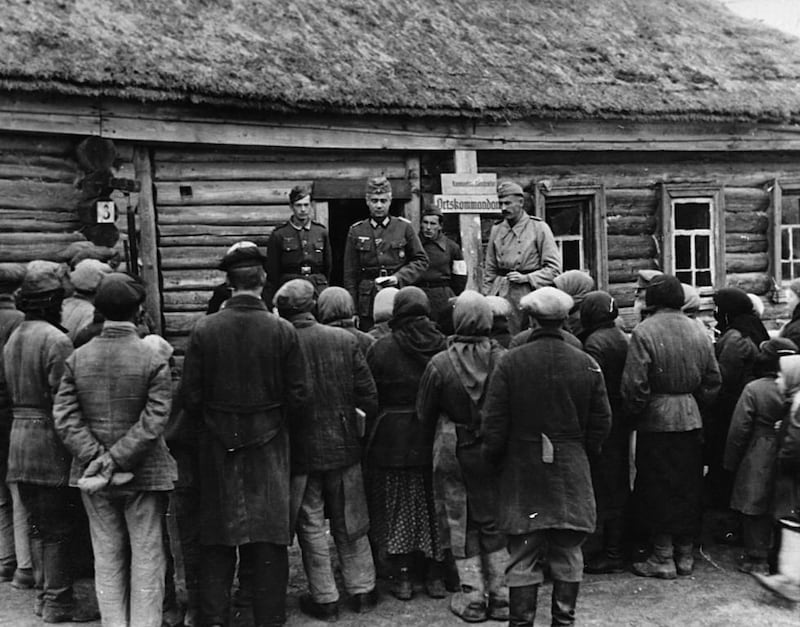 Ukrainians await orders from German soldiers, circa 1941-45. Rachel Seiffert’s A Boy in Winter is a story set during the round-up of Jews in a Ukrainian town in 1941, showing the bravery of strangers as well as the cowardice of the collaborators. Corbis via Getty Images 