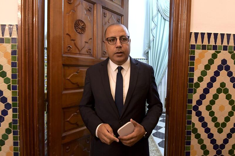 Tunisia's Prime Minister-designate Hichem Mechichi briefs the media about his proposed government list during a press conference in Carthage, east of the capital Tunis, on August 10, 2020. Tunisia's president tasked Mechichi last month with forming a government. / AFP / FETHI BELAID
