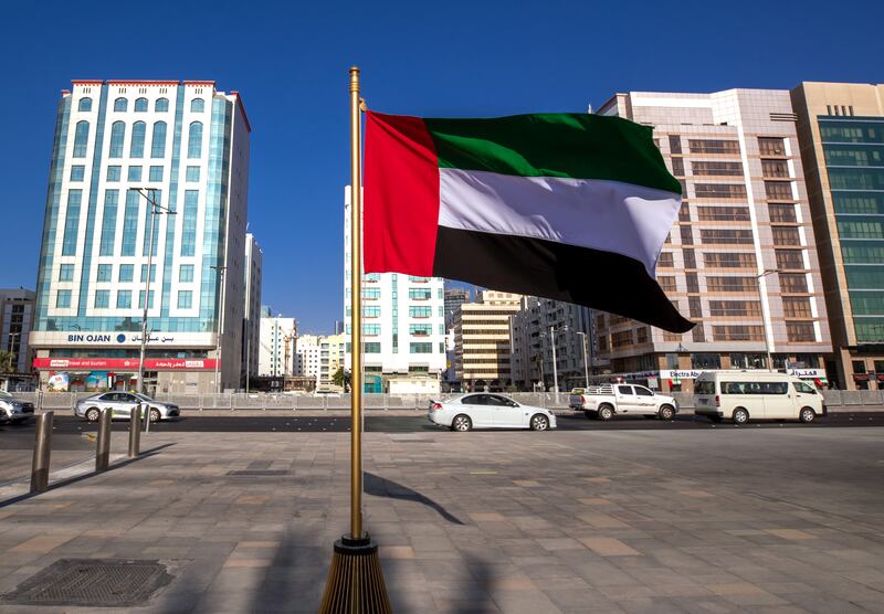 The UAE flag outside Abu Dhabi City Municipality buildings. Victor Besa / The National.