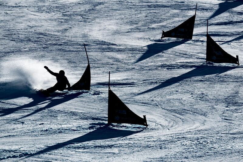 An athlete competes during the women's parallel slalom at the FIS Snowboard Alpine World Championships  in Rogla, Slovenia, on Tuesday, March 2. Getty