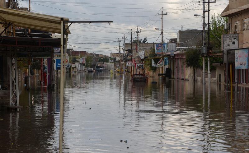 A street is flooded by heavy rain in the northern Iraqi city of Mosul. AFP
