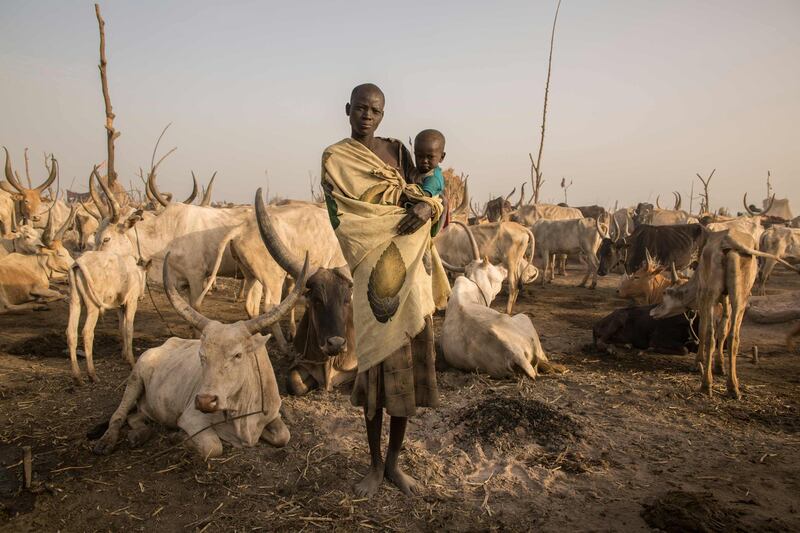 South Sudanese cattle herder Mary Amer poses with her child in a camp in Mingkaman, South Sudan. Stefanie Glinski / AFP Photo