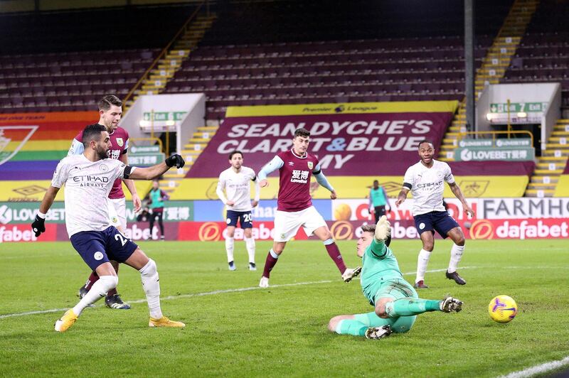 BURNLEY, ENGLAND - FEBRUARY 03: Riyad Mahrez of Manchester City scores a goal which is later disallowed by VAR during the Premier League match between Burnley and Manchester City at Turf Moor on February 03, 2021 in Burnley, England. Sporting stadiums around the UK remain under strict restrictions due to the Coronavirus Pandemic as Government social distancing laws prohibit fans inside venues resulting in games being played behind closed doors. (Photo by Alex Pantling/Getty Images)