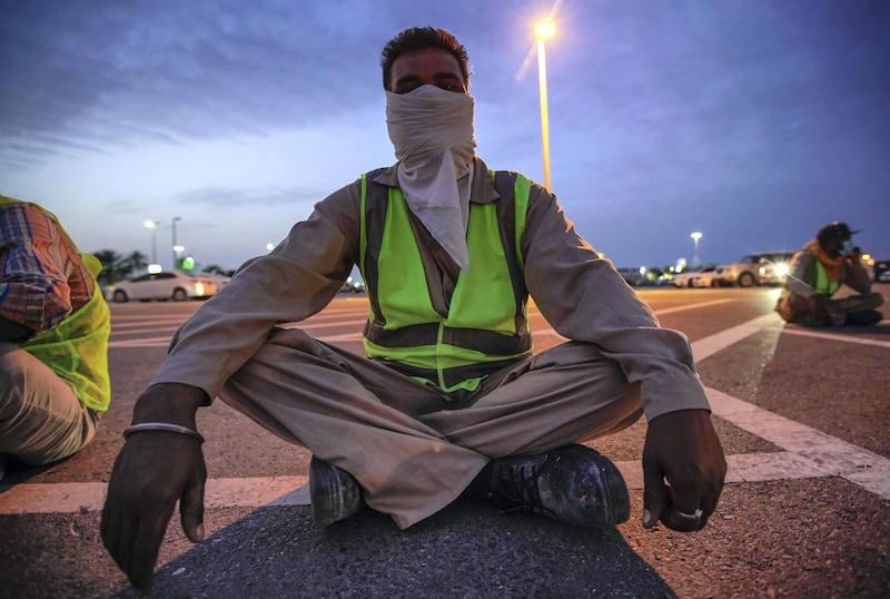 Abu Dhabi, United Arab Emirates, March 27, 2020.   
  Sanitation workers from Tadweer get ready on the first day of the UAE cleaning campaign.  Emiratis and residents across the UAE must stay home this weekend while a nationwide cleaning and sterilisation drive is carried out.
Victor Besa / The National
Section:  NA
Reporter:  Haneen Dajani