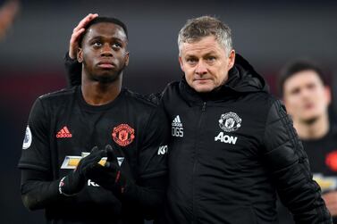 LONDON, ENGLAND - JANUARY 01: Ole Gunnar Solskjaer, Manager of Manchester United speaks to Aaron Wan-Bissaka of Manchester United after the Premier League match between Arsenal FC and Manchester United at Emirates Stadium on January 01, 2020 in London, United Kingdom. (Photo by Clive Mason/Getty Images)