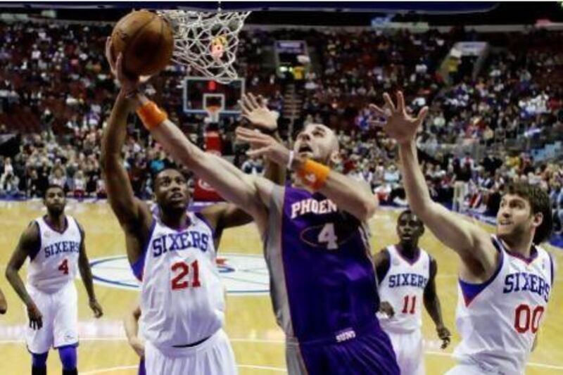 The Philadelphia 76ers, in white, have had to contend without the unpredictable Andrew Bynum this season. Matt Slocum / AP Photo