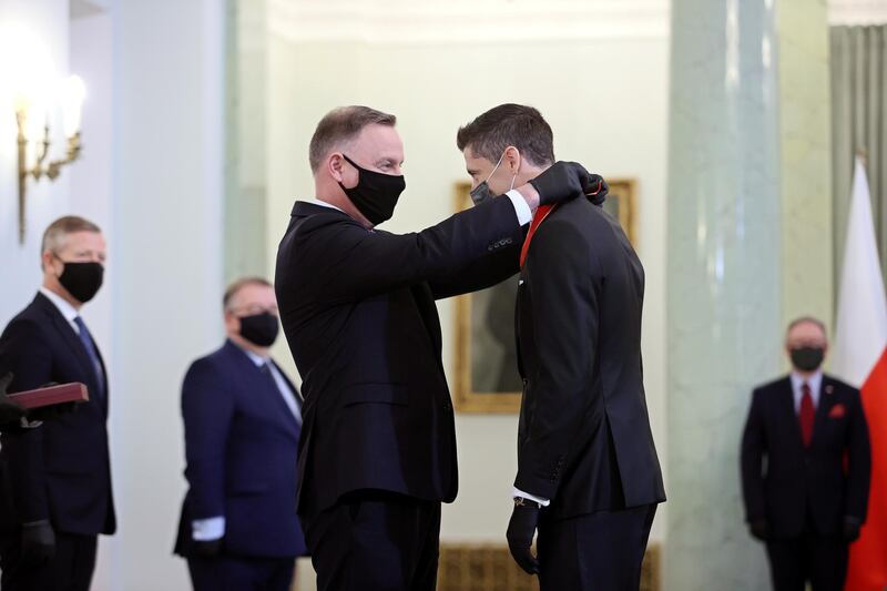 Robert Lewandowski receives the Commander's Cross of the Order of Polonia Restituta from Polish President Andrzej Duda at the Presidential Palace in Warsaw. EPA